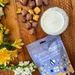 Belgian Milk chocolate honeycomb a Yummycomb pouch bag 100g scattered on a country kitchen table