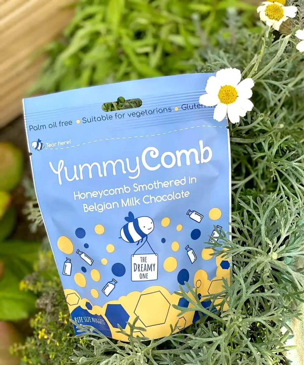 Yummycomb sharing pouch bag of Milk Belgian chocolate honeycomb in a spring garden