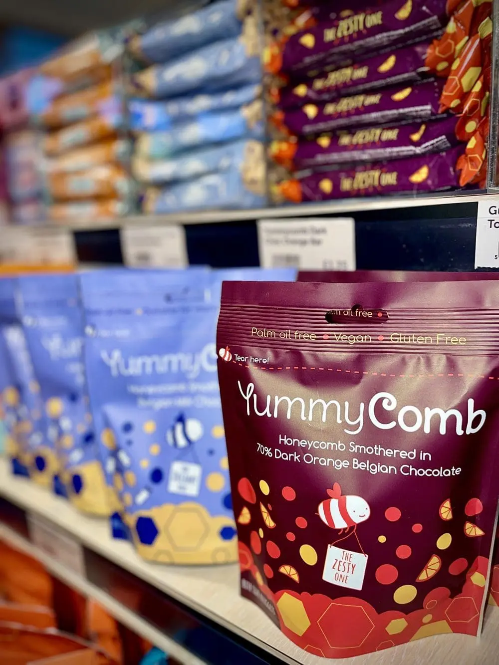 Yummycomb premium Milk and dark orange Belgian chocolate honeycomb pouch bags and bars in a shop